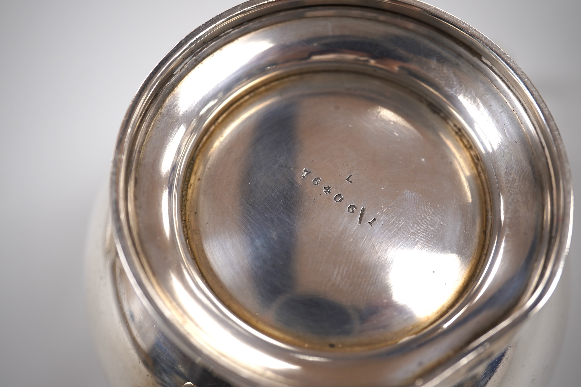 A George V silver circular three piece tea set, with engraved initial, Fenton, Russell & Co Ltd, London, 1927, gross weight 32.4oz.